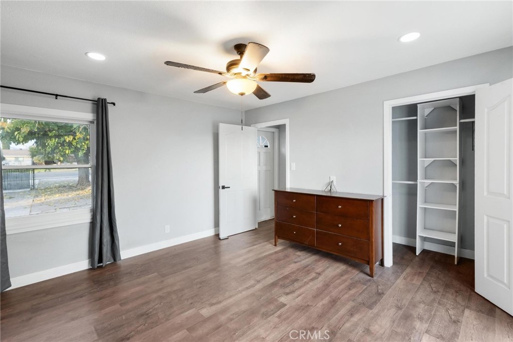 34789 Wildwood Canyon Road Yucaipa, CA 92399 - Photo 30 of 52 a view of an empty room with a window and wooden floor