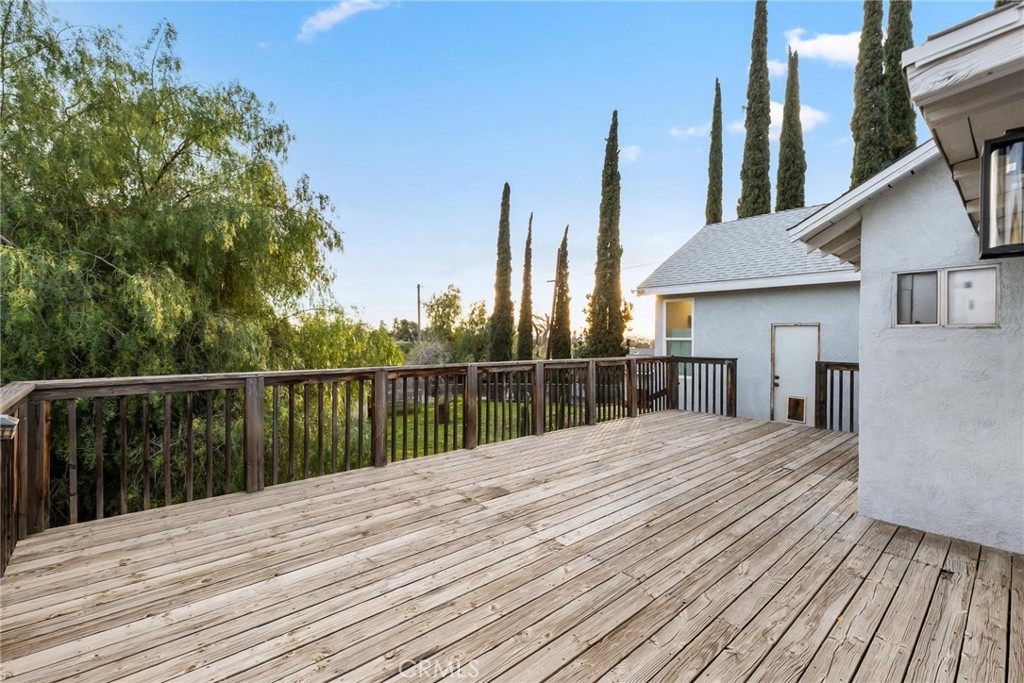34789 Wildwood Canyon Road Yucaipa, CA 92399 - Photo 37 of 52 a balcony with wooden floor and fence