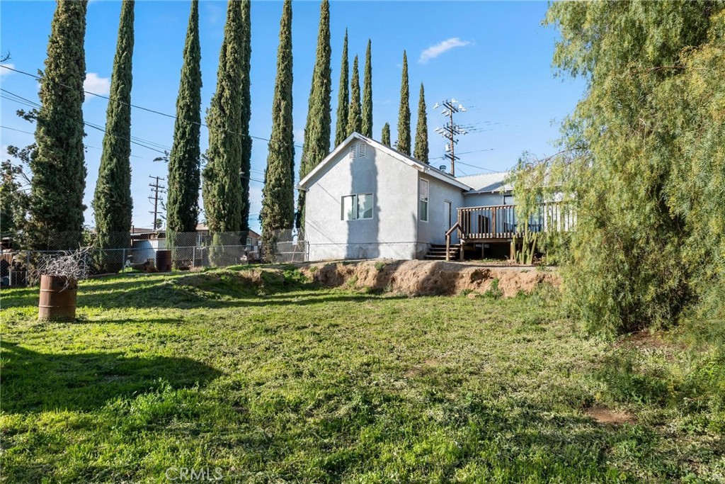 34789 Wildwood Canyon Road Yucaipa, CA 92399 - Photo 42 of 52 a front view of a house with a yard table and chairs