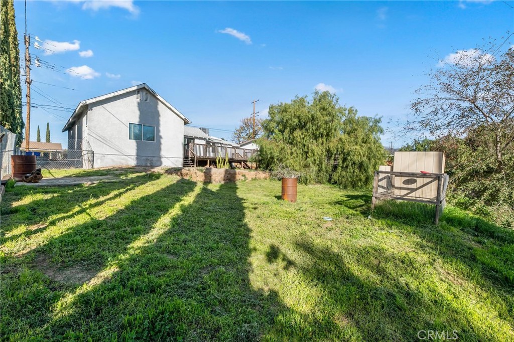 34789 Wildwood Canyon Road Yucaipa, CA 92399 - Photo 43 of 52 a backyard of a house with table and chairs