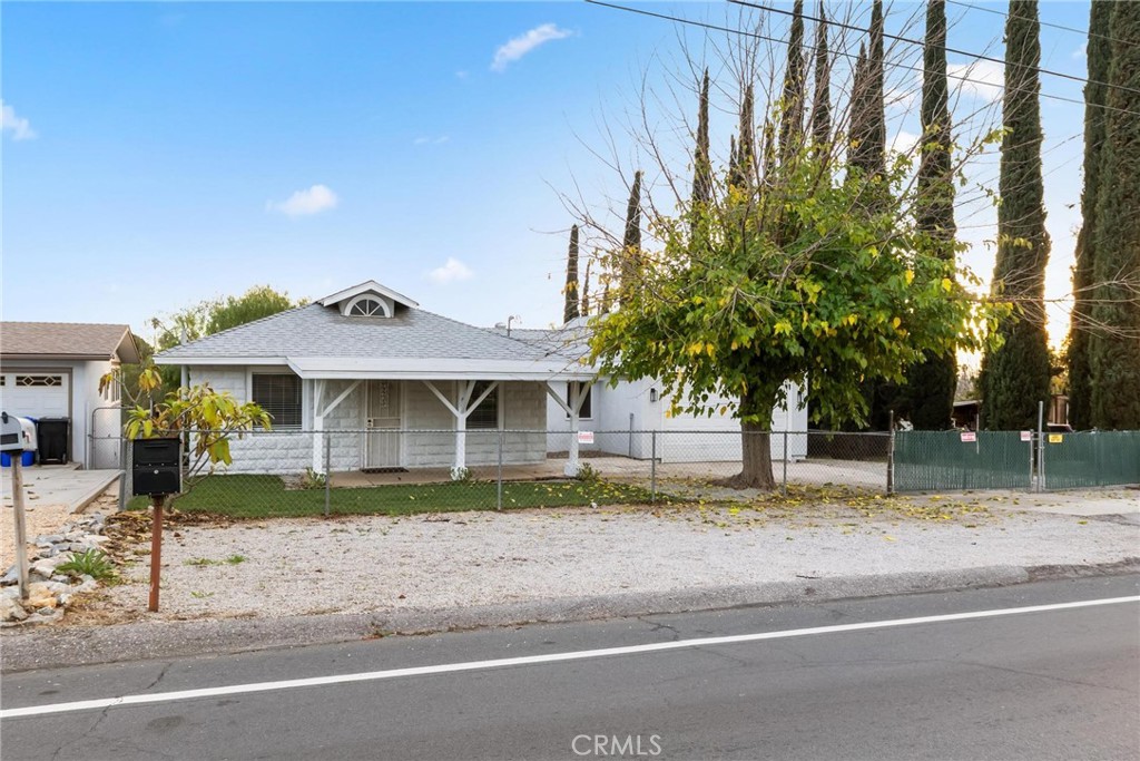 34789 Wildwood Canyon Road Yucaipa, CA 92399 - Photo 52 of 52 a front view of a house with a yard
