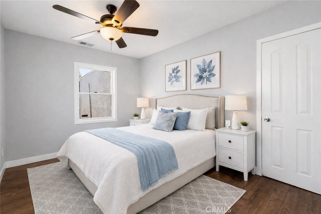 34789 Wildwood Canyon Road Yucaipa, CA 92399 - Photo 10 of 52 a bedroom with a large bed and a window