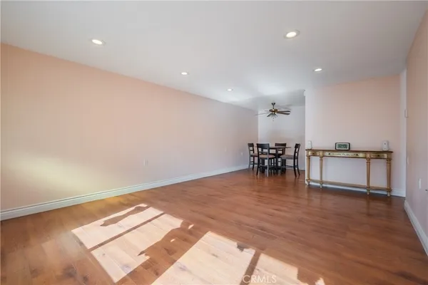 a view of a dining room with furniture and a wooden floor