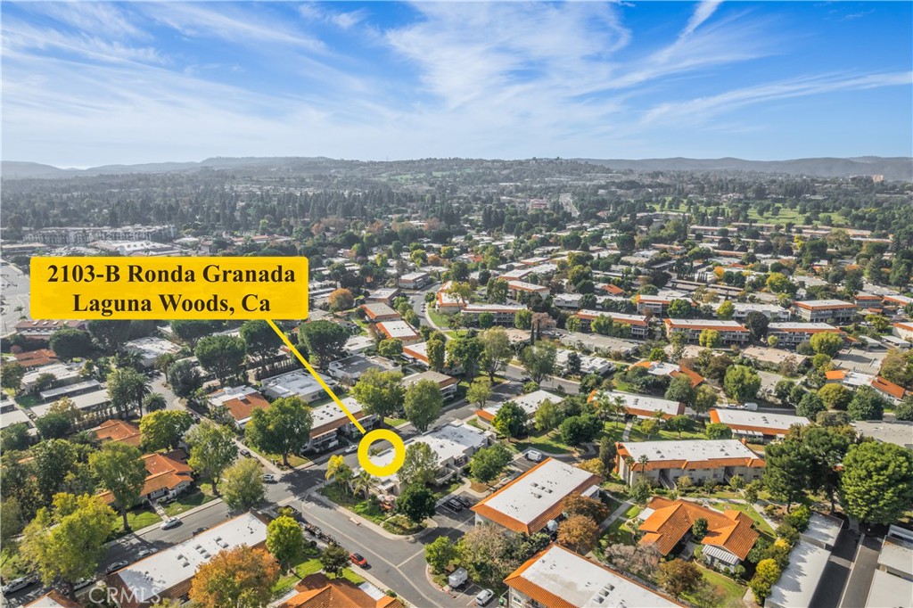 2103 Ronda Granada, Unit B Laguna Woods, CA 92637 - Photo 22 of 22 an aerial view of residential houses with swimming pool and ocean view