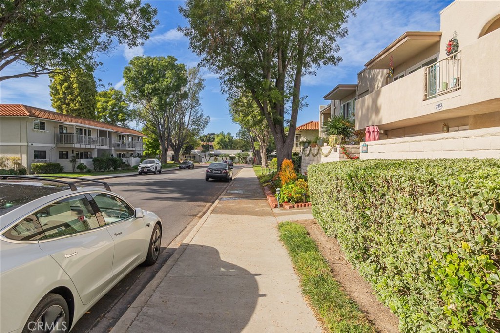 2103 Ronda Granada, Unit B Laguna Woods, CA 92637 - Photo 7 of 22 a view of a street with cars on road