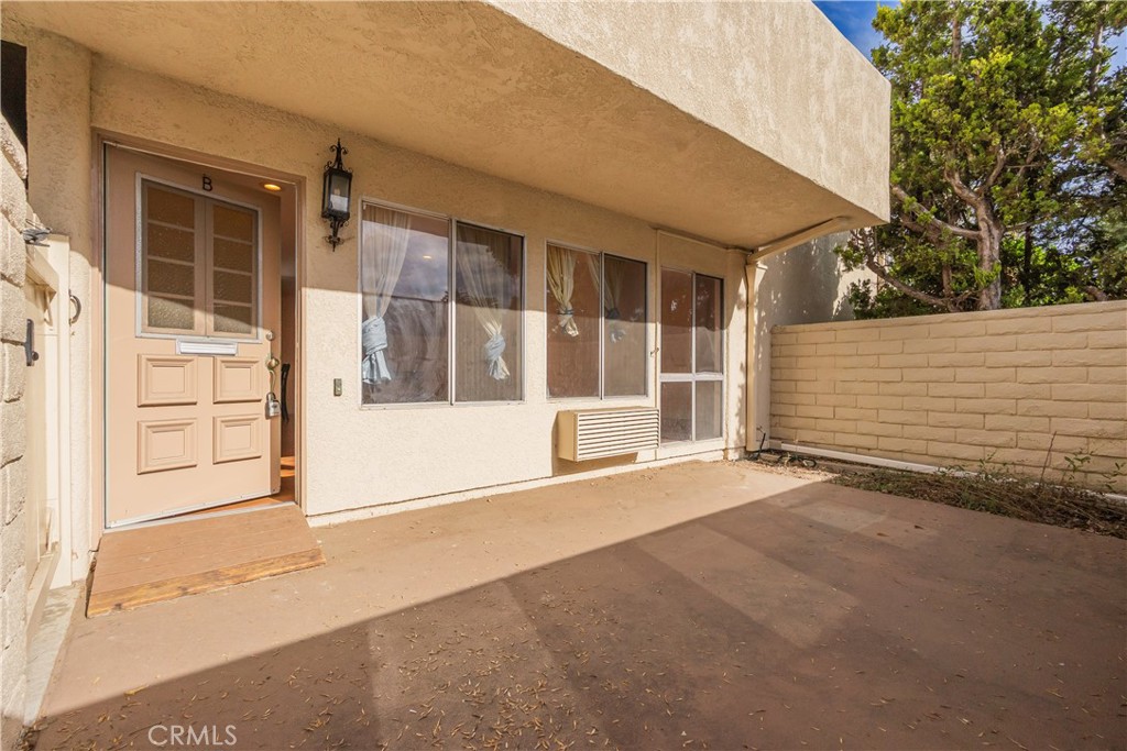 2103 Ronda Granada, Unit B Laguna Woods, CA 92637 - Photo 8 of 22 front view of a house with a garage