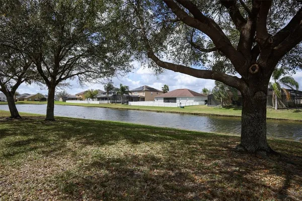 an aerial view of a house with a lake view