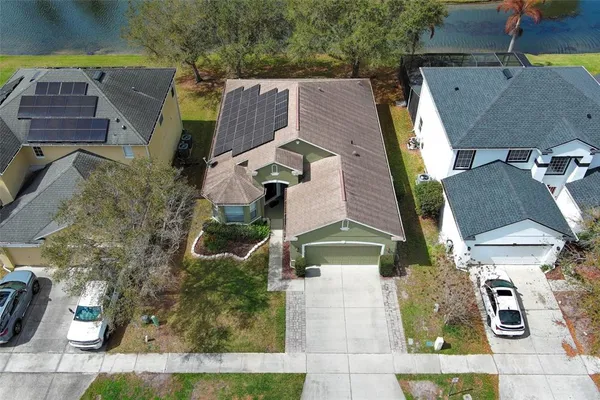 an aerial view of residential houses with outdoor space