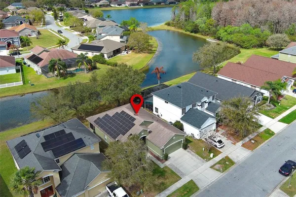 an aerial view of residential houses with outdoor space