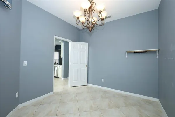 a view of a livingroom with a ceiling fan and window