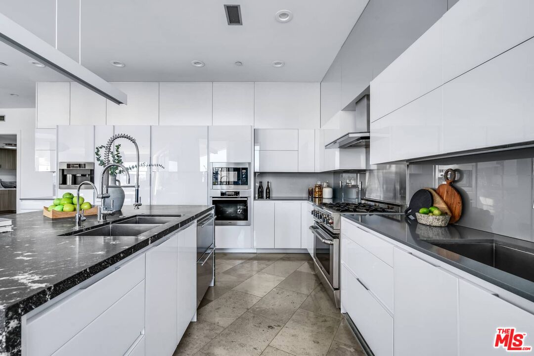 4634 Libbit Avenue Encino, CA 91436 - Photo 15 of 40 a kitchen with sink a stove and cabinets
