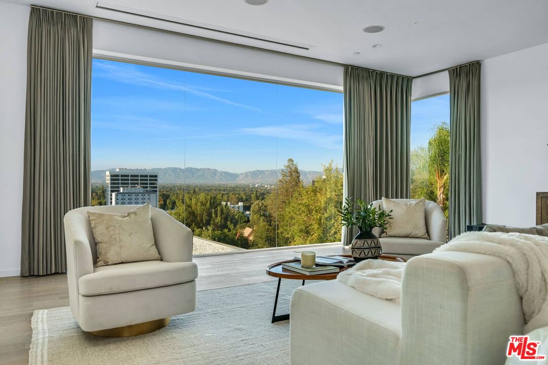 4634 Libbit Avenue Encino, CA 91436 - Photo 17 of 40 a living room with furniture and a large window