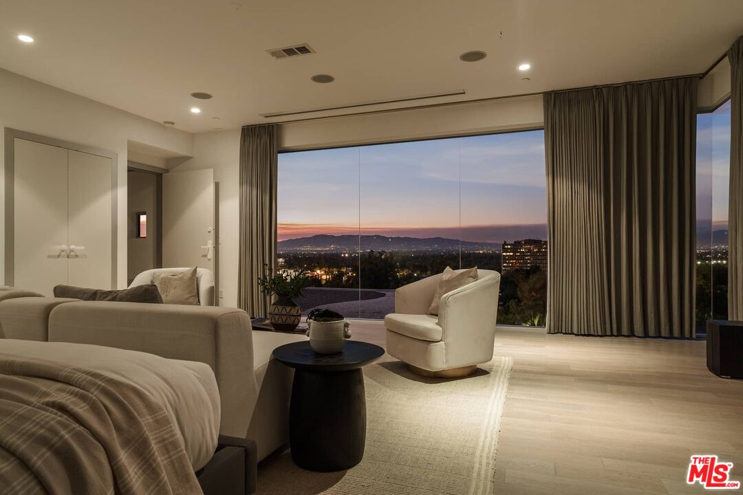 4634 Libbit Avenue Encino, CA 91436 - Photo 18 of 40 a living room with furniture and a large window