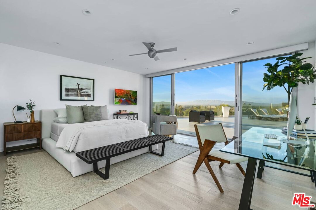 4634 Libbit Avenue Encino, CA 91436 - Photo 23 of 40 a bed room with a bed and a couch