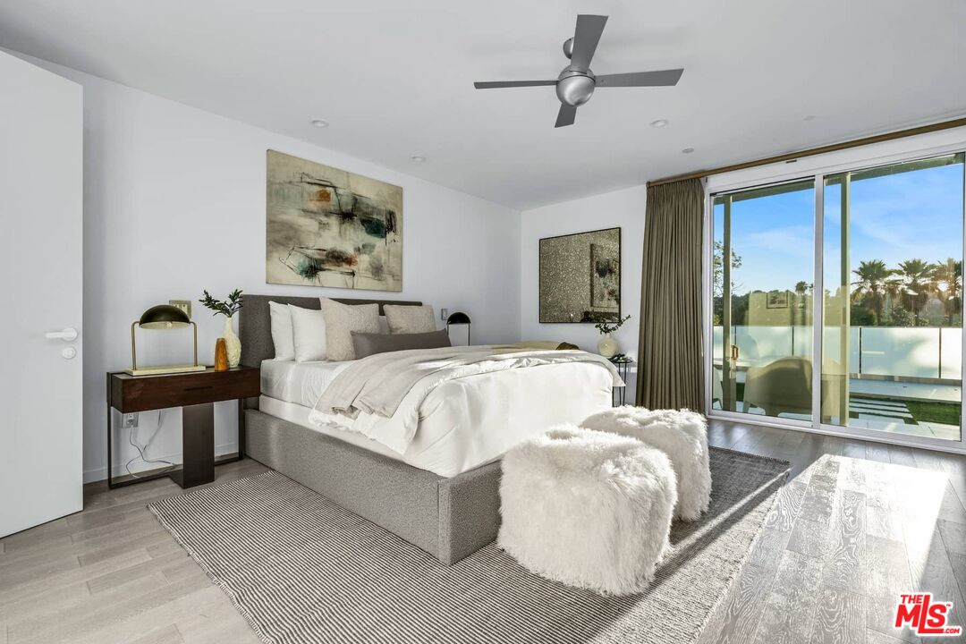 4634 Libbit Avenue Encino, CA 91436 - Photo 25 of 40 a bed sitting in a bedroom next to a window