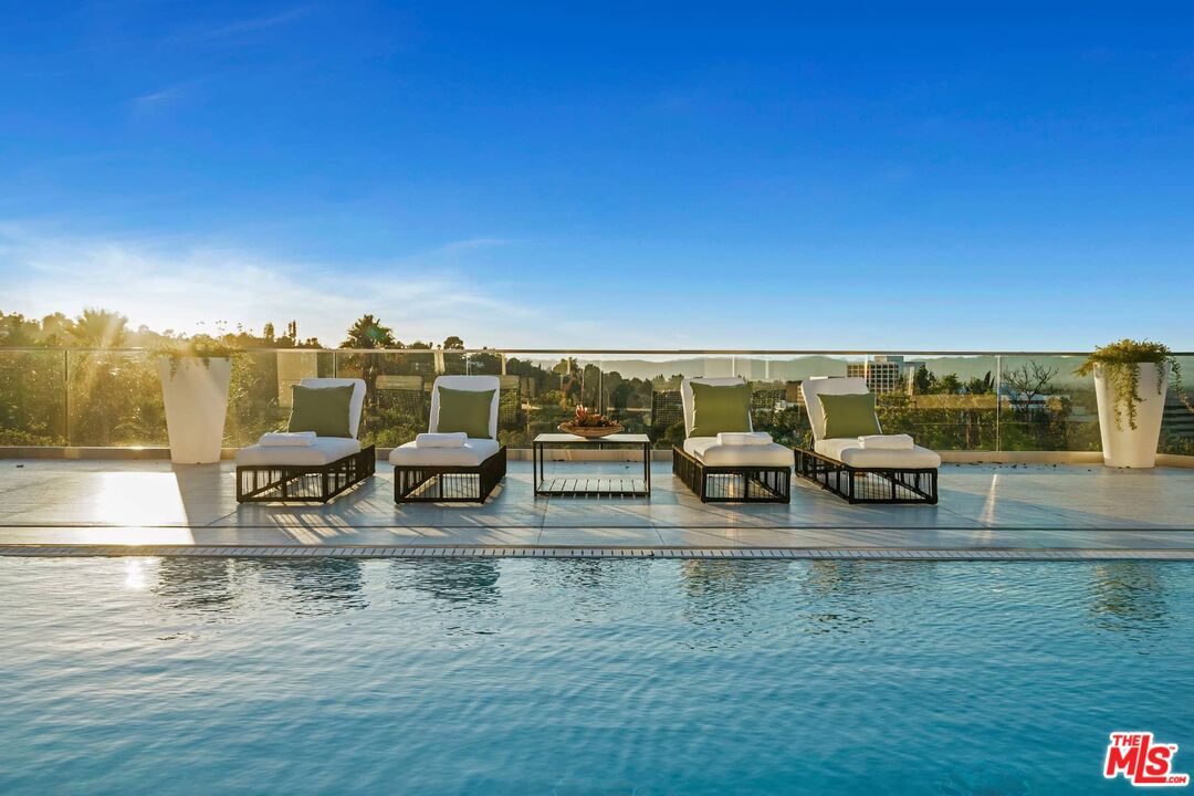 4634 Libbit Avenue Encino, CA 91436 - Photo 27 of 40 a view of swimming pool with outdoor seating and yard