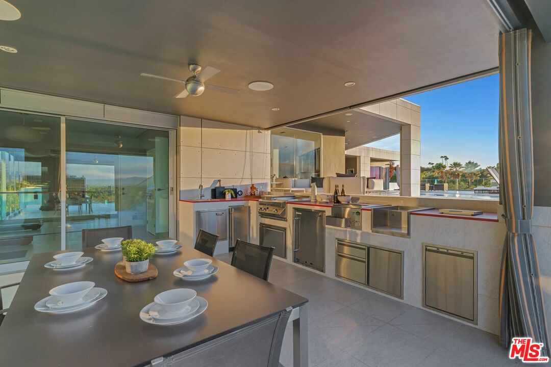 4634 Libbit Avenue Encino, CA 91436 - Photo 28 of 40 a open dining room with stainless steel appliances granite countertop a table and chairs