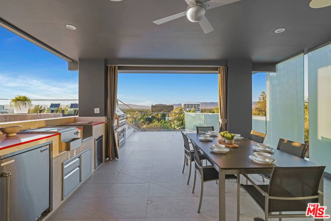 4634 Libbit Avenue Encino, CA 91436 - Photo 29 of 40 a open kitchen with a table and chairs
