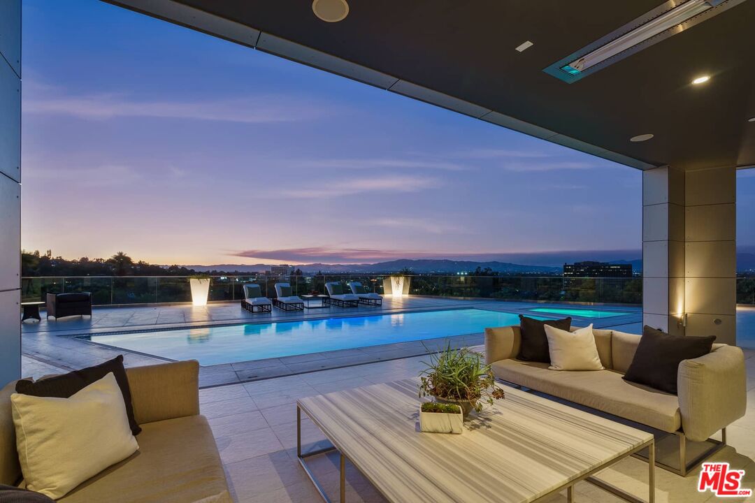 4634 Libbit Avenue Encino, CA 91436 - Photo 3 of 40 a view of a patio with couches and city view