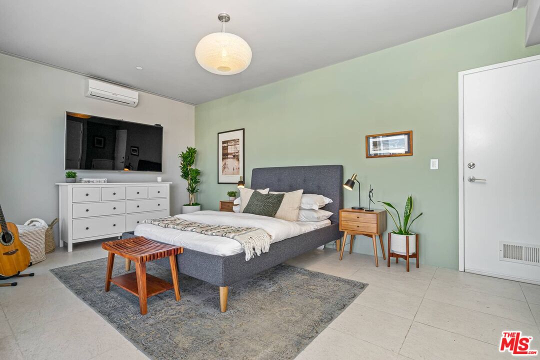 4634 Libbit Avenue Encino, CA 91436 - Photo 31 of 40 a bedroom with a bed and a flat screen tv