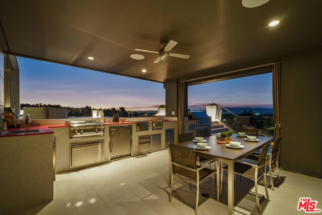 4634 Libbit Avenue Encino, CA 91436 - Photo 34 of 40 a view of a dining room with furniture a chandelier and wooden floor