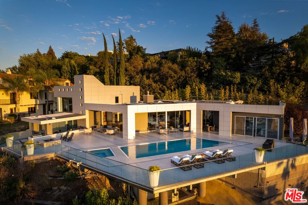 4634 Libbit Avenue Encino, CA 91436 - Photo 38 of 40 a view of a house with swimming pool and sitting area