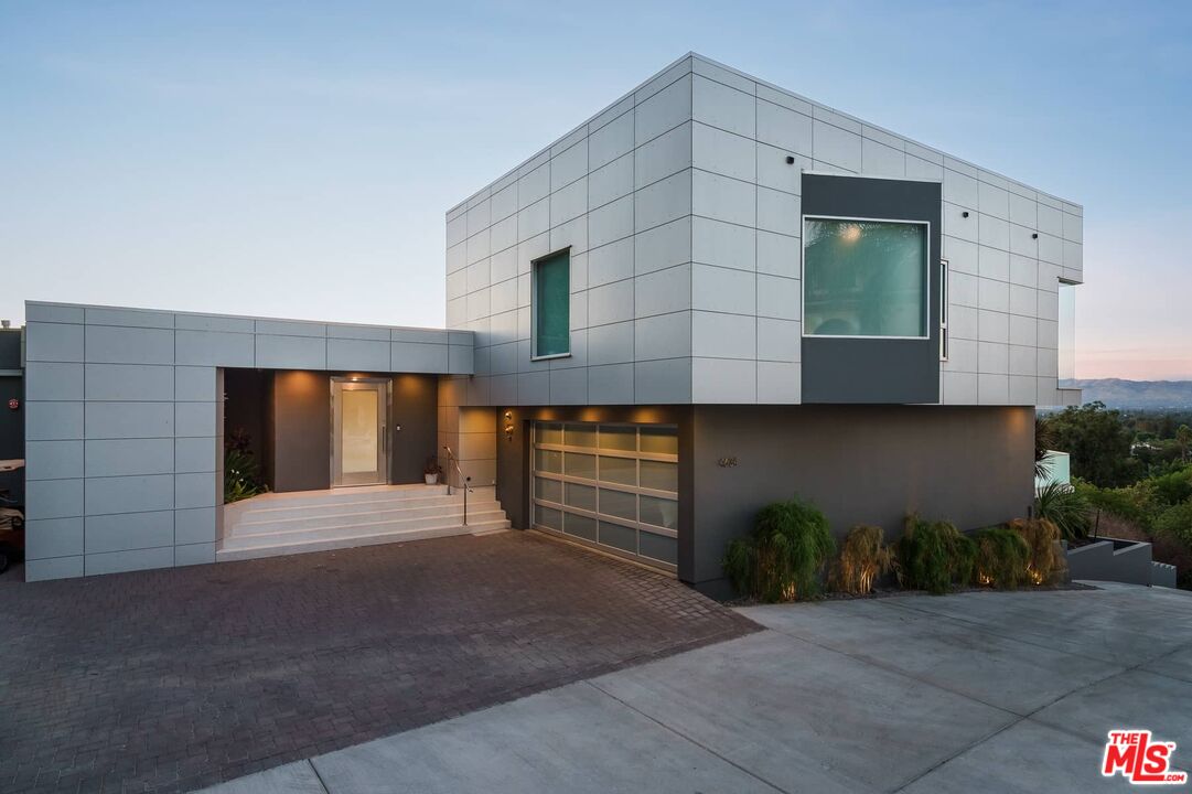 4634 Libbit Avenue Encino, CA 91436 - Photo 40 of 40 a front view of a house with a yard and garage