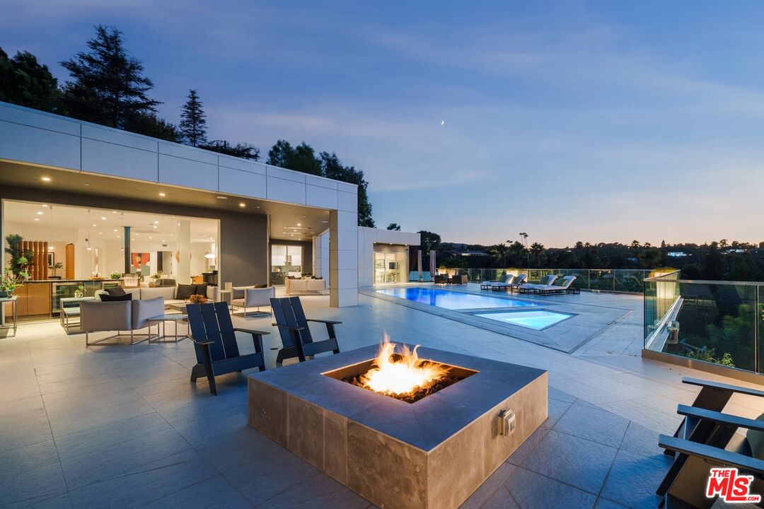 4634 Libbit Avenue Encino, CA 91436 - Photo 9 of 40 a living room with furniture a flat screen tv and a table