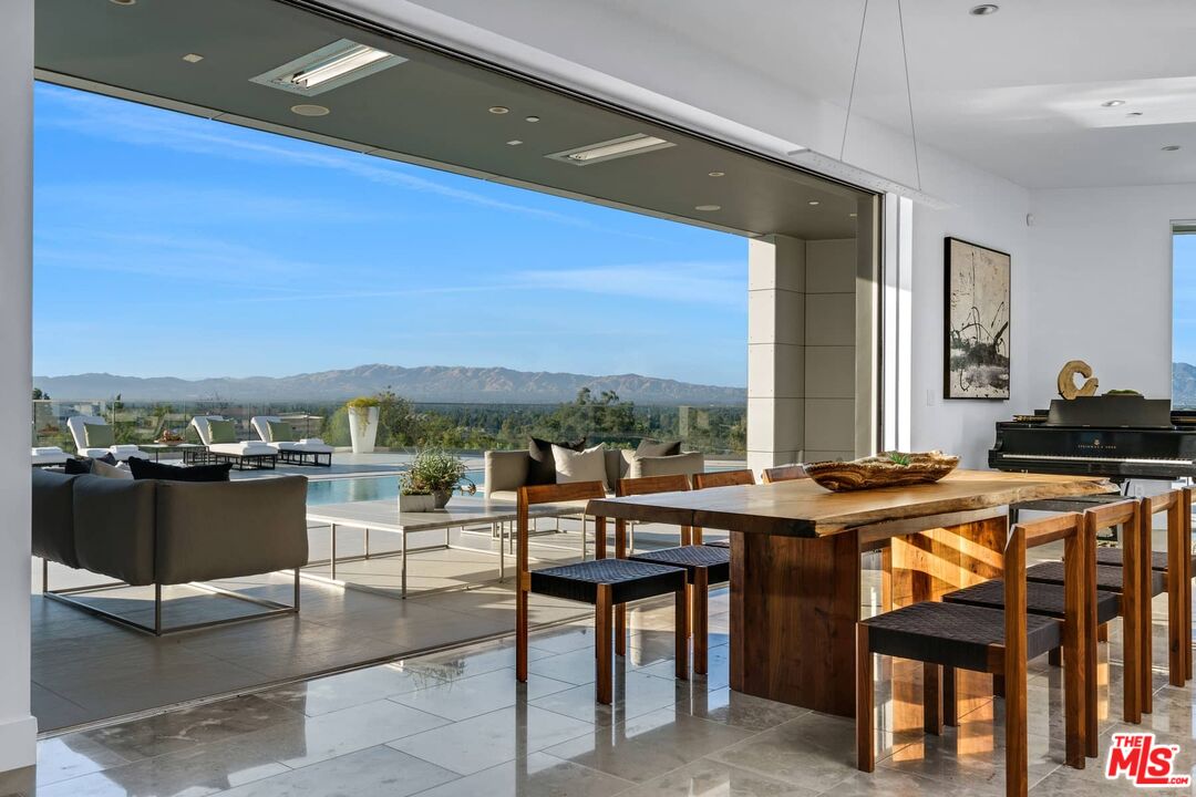 4634 Libbit Avenue Encino, CA 91436 - Photo 10 of 40 a view of a patio with a table and chairs