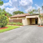 a view of a house with a yard and garage