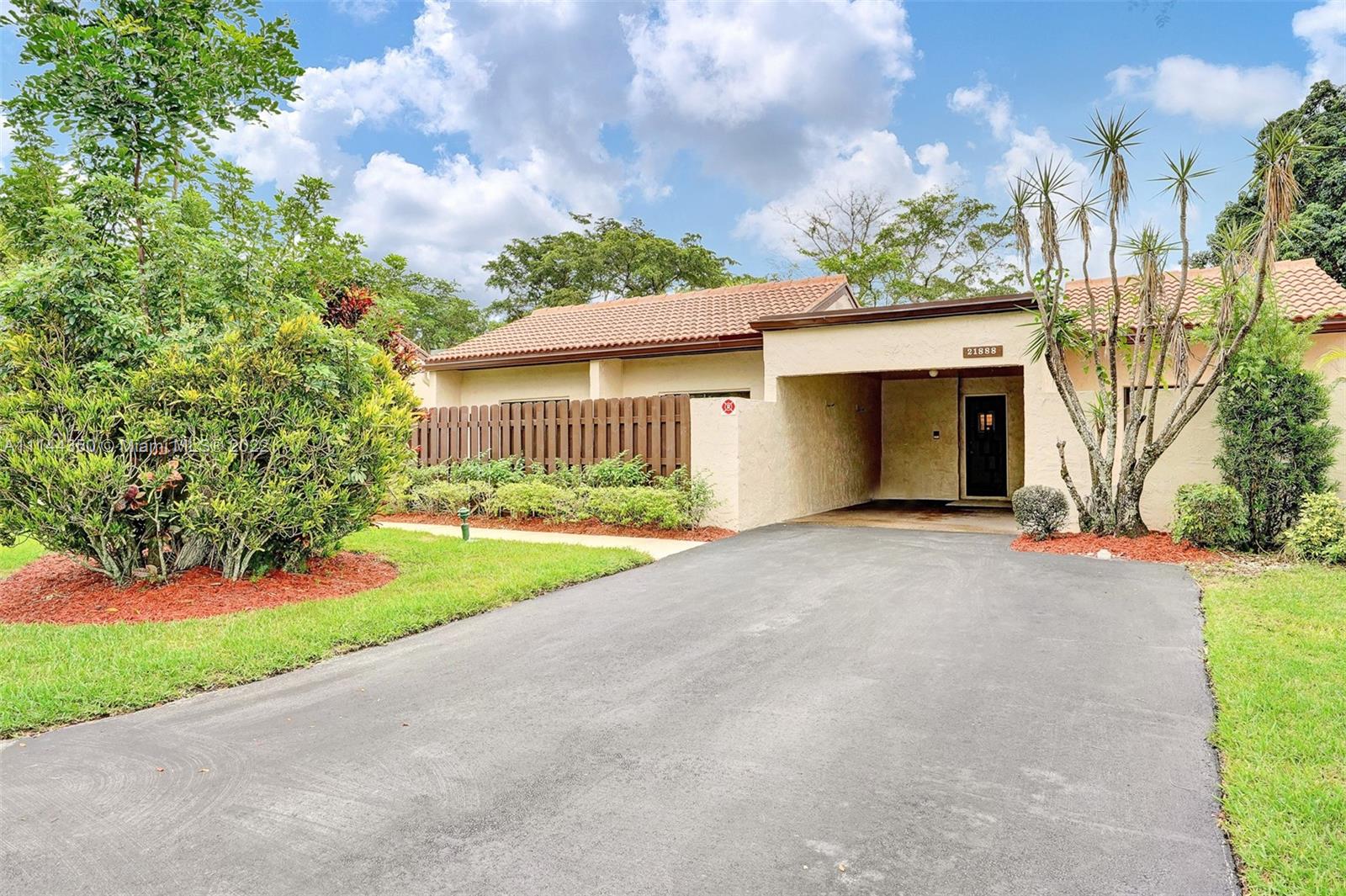 21888 Cypress Circle Boca Raton, FL 33433 - Photo 1 of 1 a view of a house with a yard and garage
