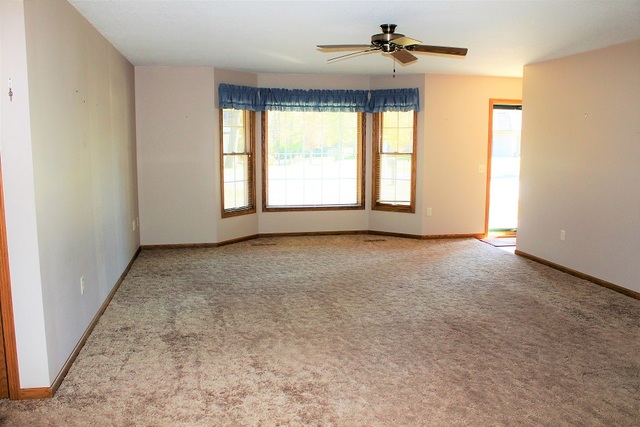 1705 Ridgewood Drive Morrison, IL 61270 - Photo 5 of 21 a view of room with a ceiling fan and window