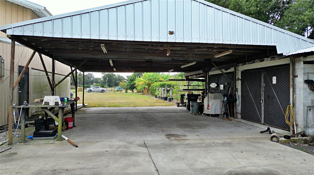 1015 Mt Pisgah Road Fort Meade, FL 33841 - Photo 8 of 20 a view of a patio with table and chairs under an umbrella