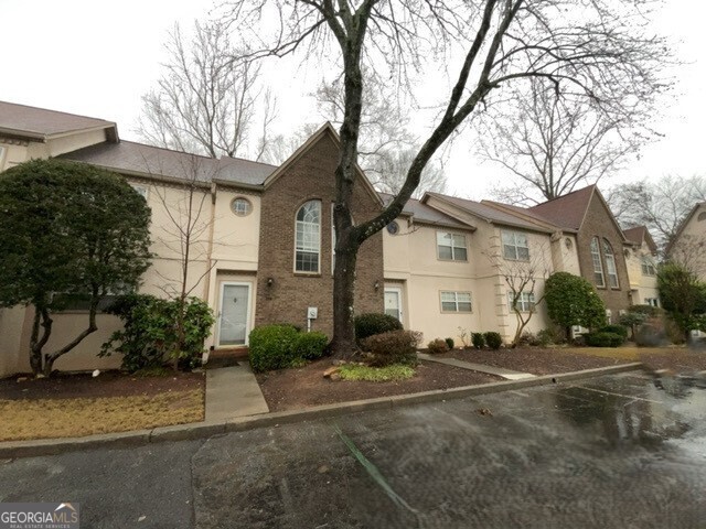 304 Bridge Lane Smyrna, GA 30082 - Photo 2 of 6 a front view of a house with a yard and garage