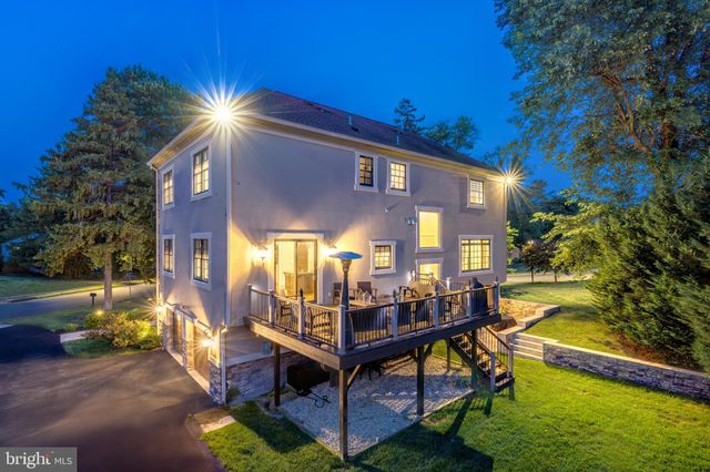 a view of a hallway with windows and stairs