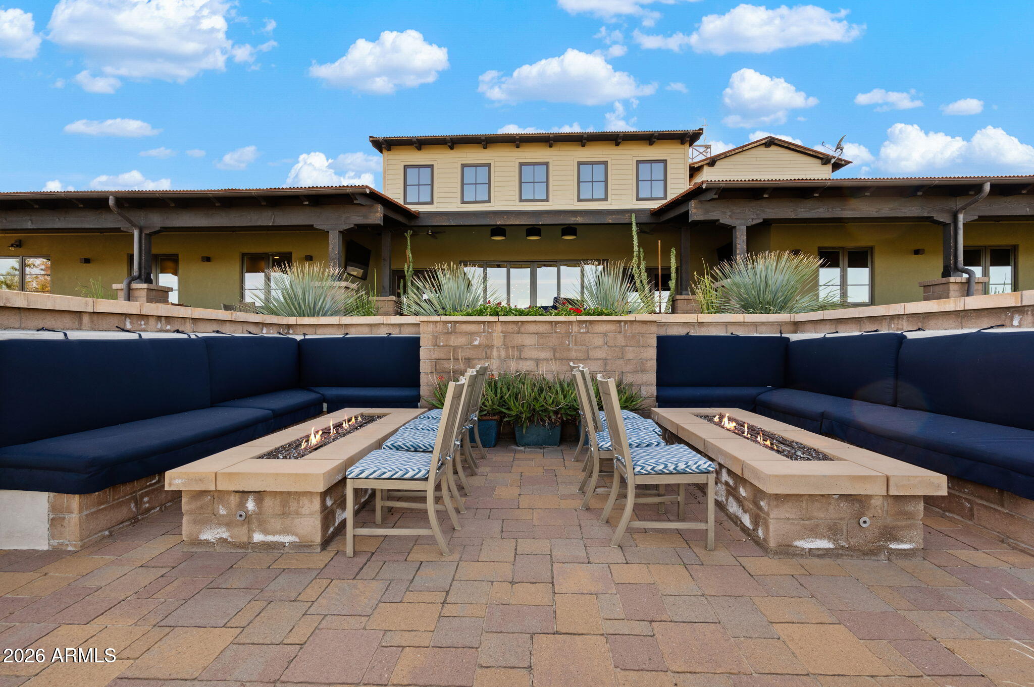 4638 Cactus Wren Road Wickenburg, AZ 85390 - Photo 29 of 31 a view of a patio with table and chairs with wooden floor and fence