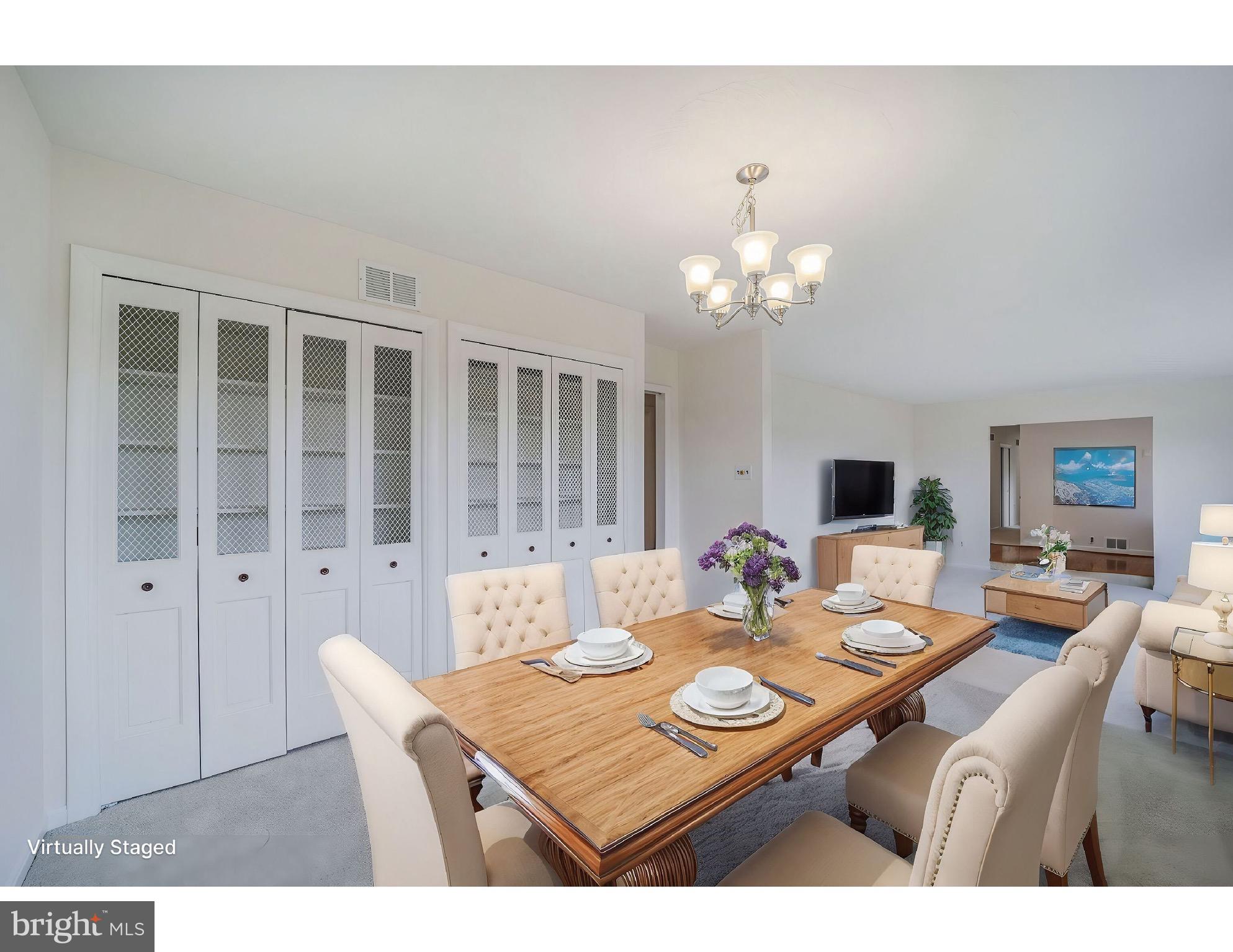5017 Ravensworth Road Annandale, VA 22003 - Photo 13 of 40 a view of a dining room with furniture and chandelier