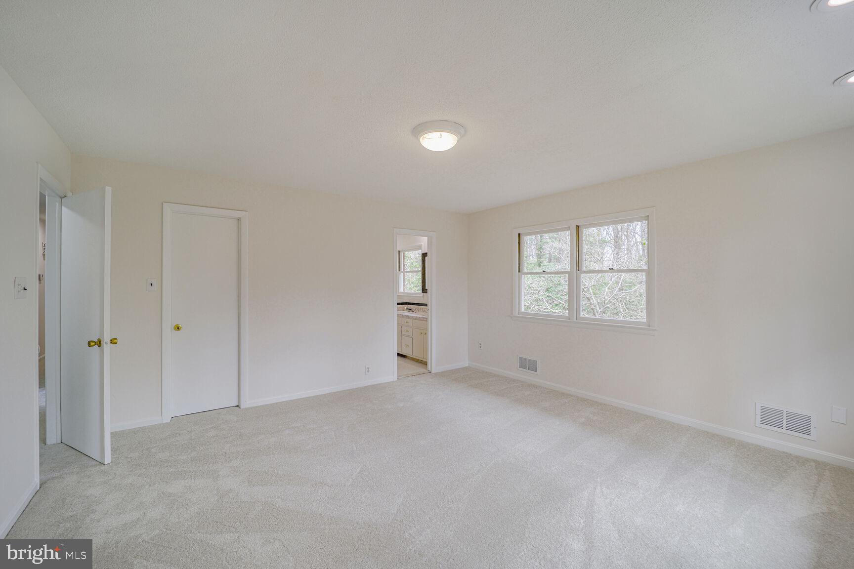 5017 Ravensworth Road Annandale, VA 22003 - Photo 17 of 40 a view of an empty room with a window
