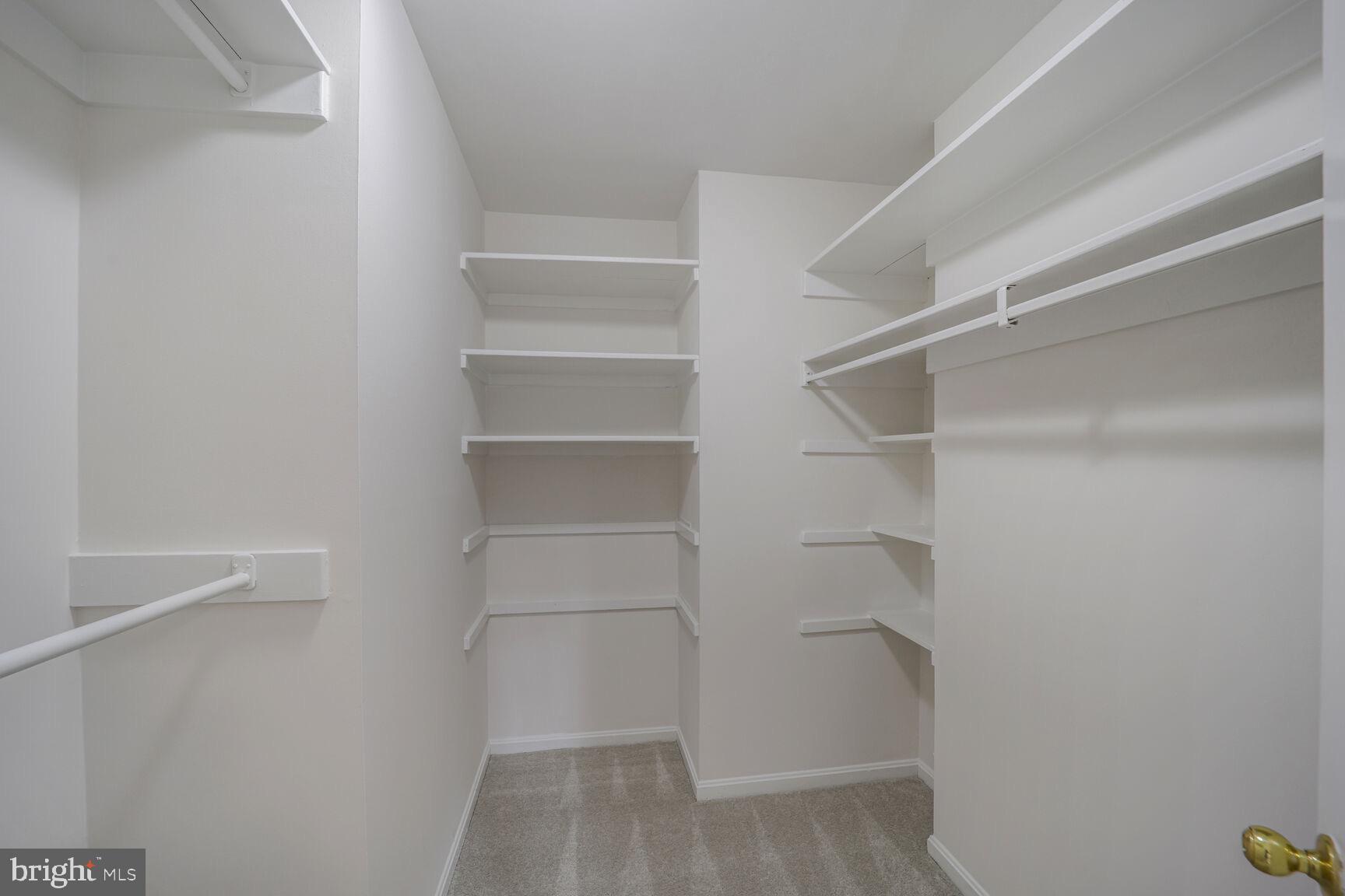 5017 Ravensworth Road Annandale, VA 22003 - Photo 19 of 40 a view of walk in closet with empty racks