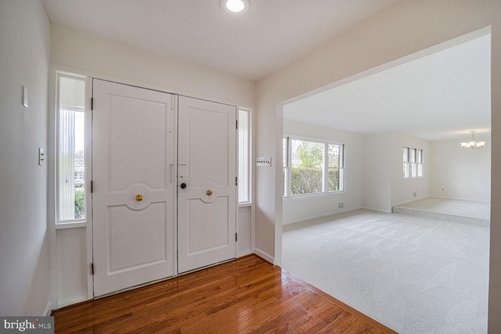 5017 Ravensworth Road Annandale, VA 22003 - Photo 2 of 40 a view of an empty room with window and wooden floor