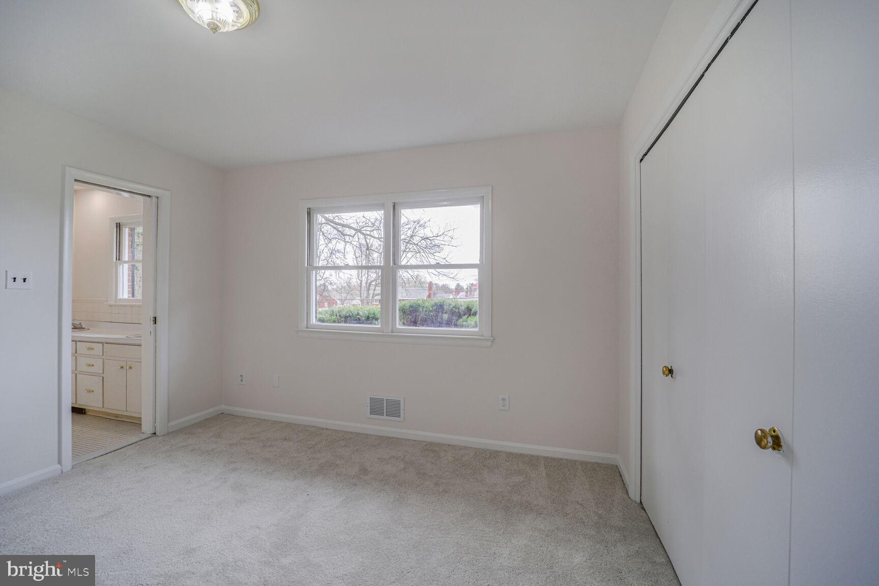 5017 Ravensworth Road Annandale, VA 22003 - Photo 23 of 40 an empty room with windows