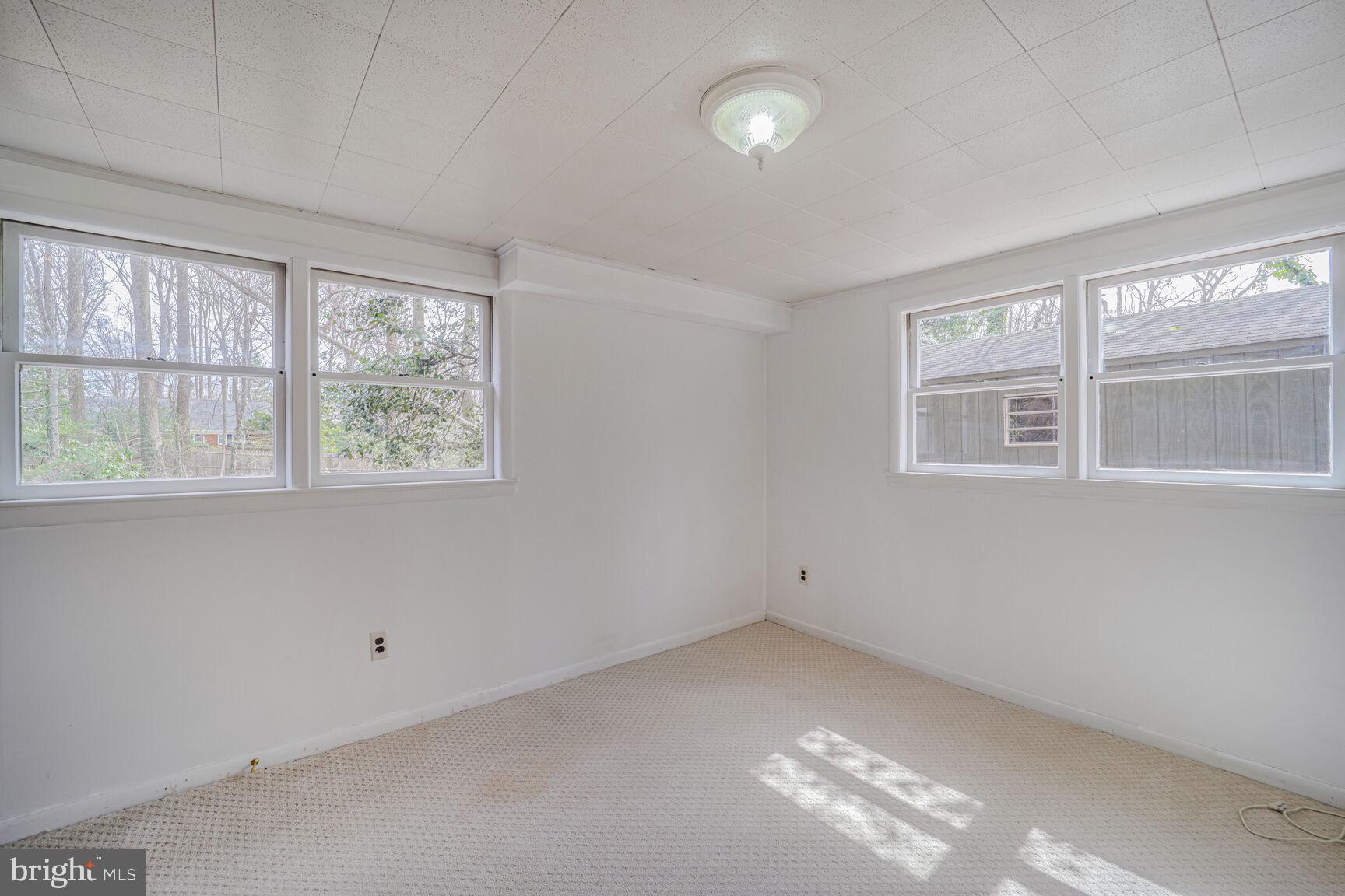 5017 Ravensworth Road Annandale, VA 22003 - Photo 31 of 40 an empty room with windows