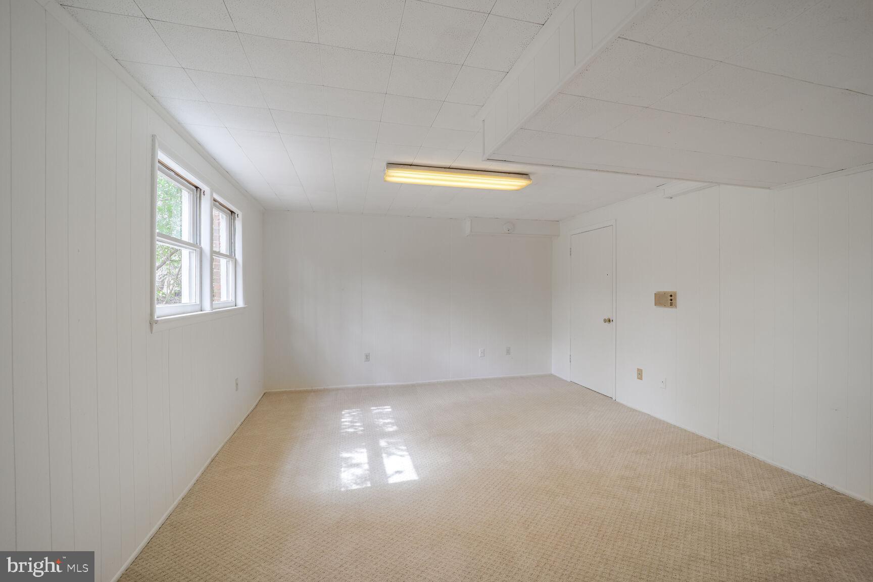 5017 Ravensworth Road Annandale, VA 22003 - Photo 33 of 40 a view of an empty room with a window