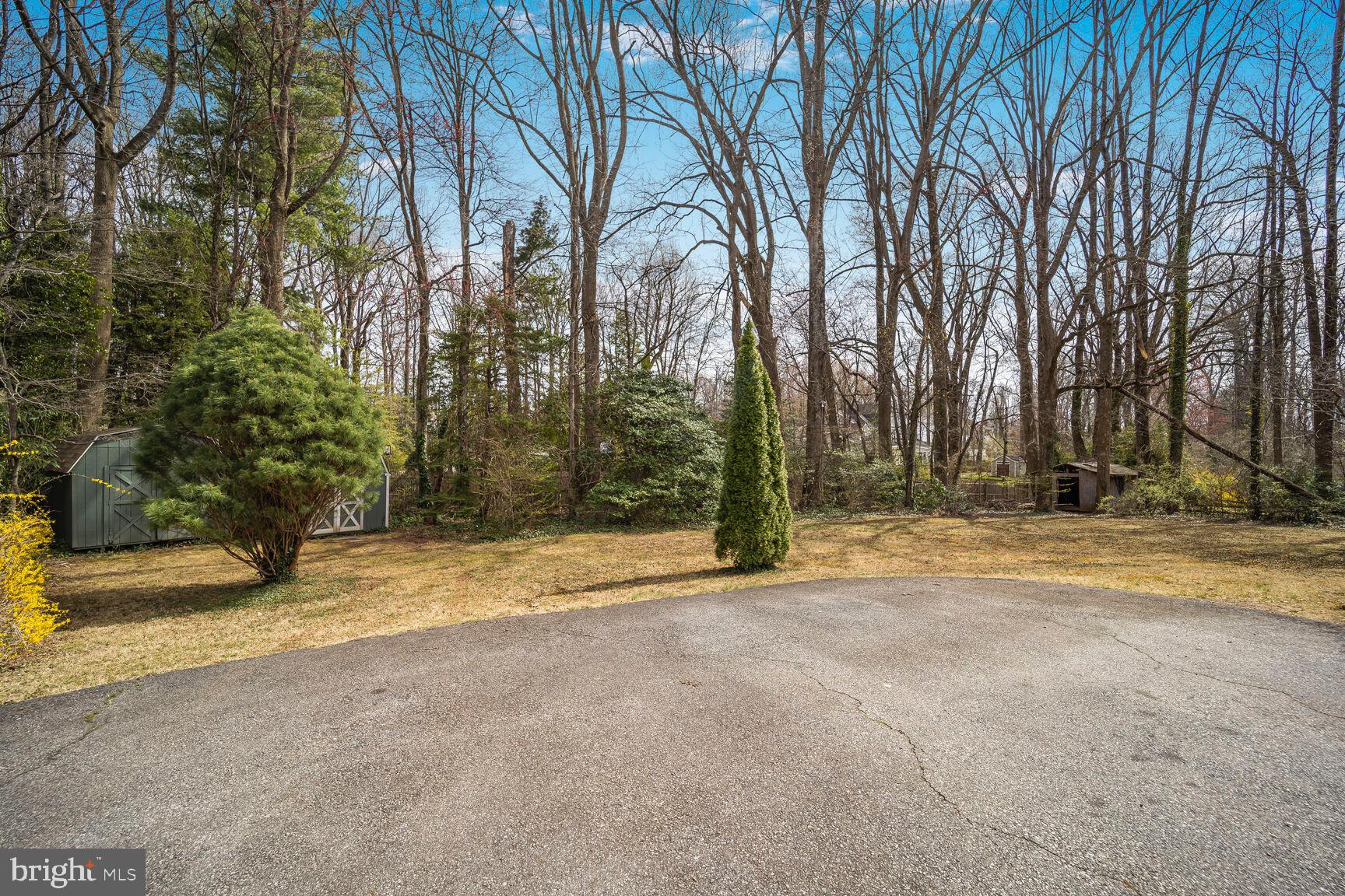 5017 Ravensworth Road Annandale, VA 22003 - Photo 36 of 40 a view of a house with large trees