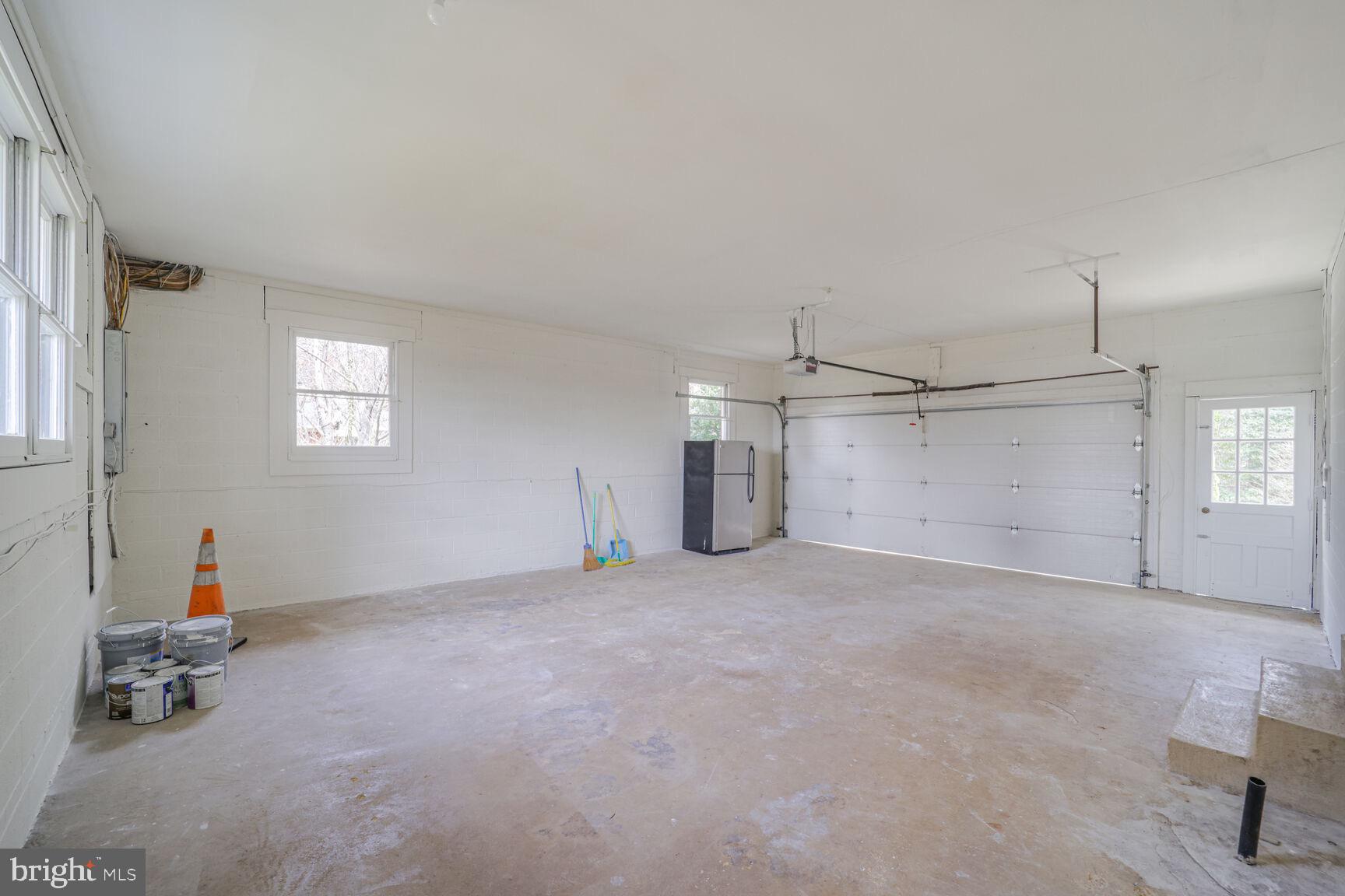 5017 Ravensworth Road Annandale, VA 22003 - Photo 38 of 40 an empty room with windows and ceiling fan