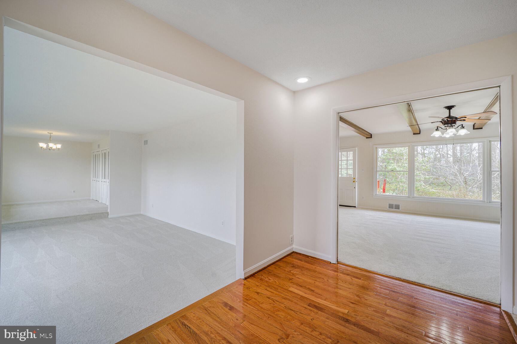 5017 Ravensworth Road Annandale, VA 22003 - Photo 4 of 40 wooden floor in an empty room with a window
