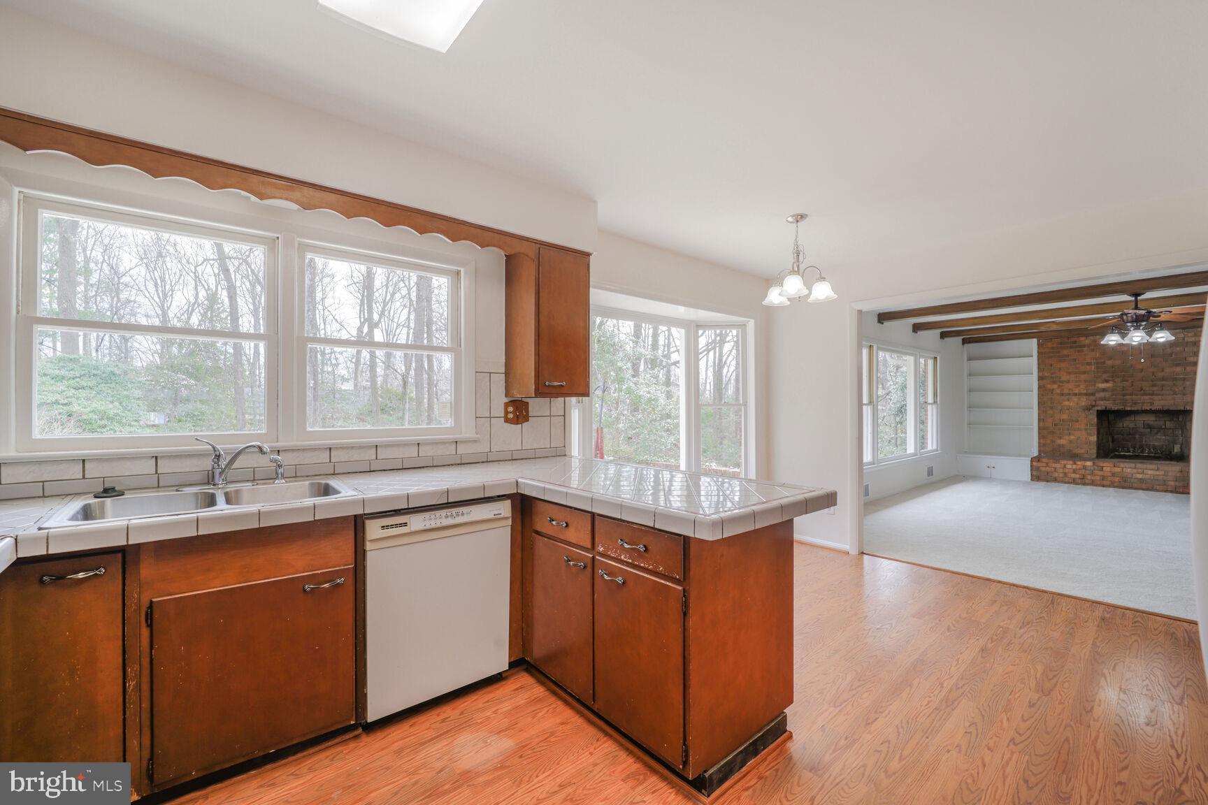 5017 Ravensworth Road Annandale, VA 22003 - Photo 7 of 40 a kitchen with a sink cabinets and window