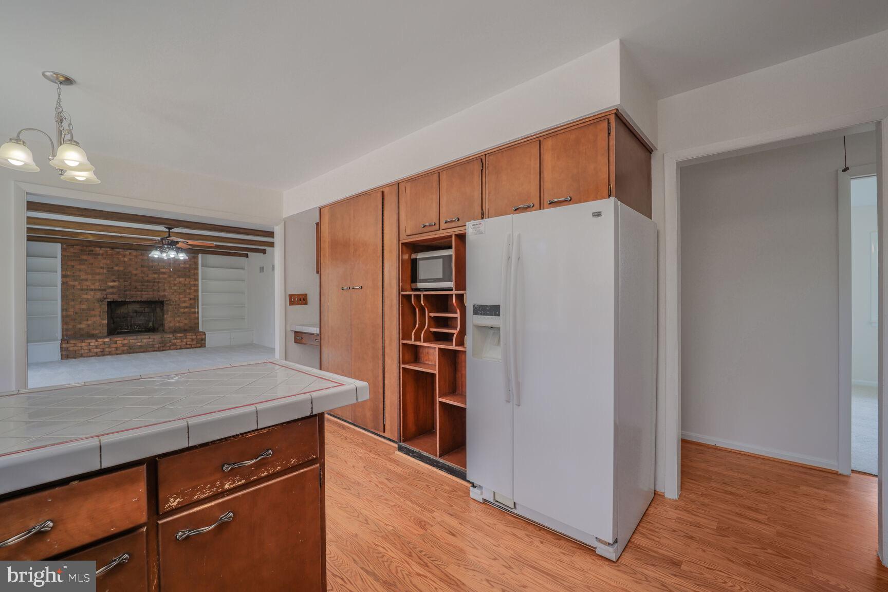5017 Ravensworth Road Annandale, VA 22003 - Photo 10 of 40 a kitchen with stainless steel appliances a refrigerator and a stove top oven
