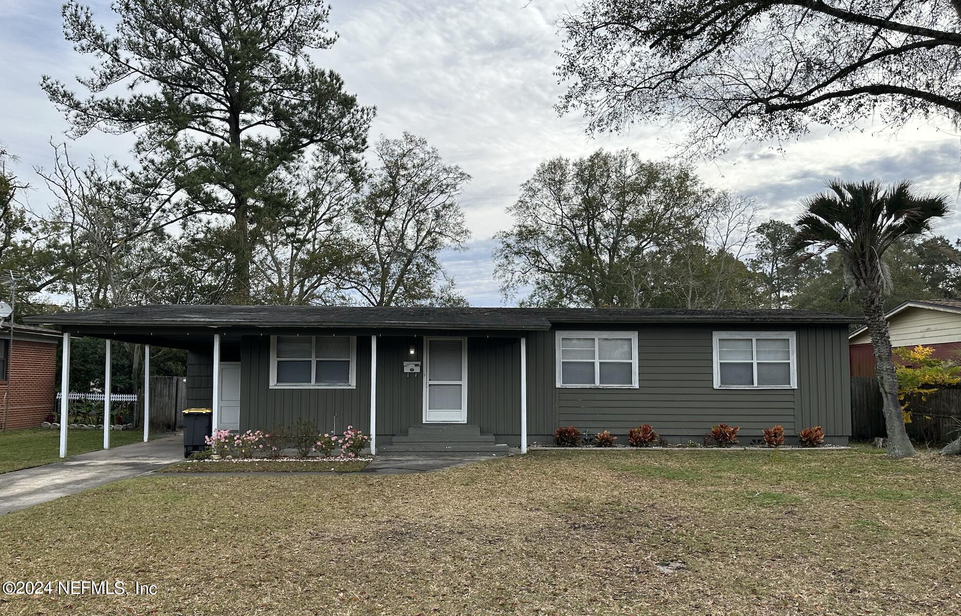 7417 Coral Sea Road Jacksonville, FL 32244 - Photo 1 of 10 a house with yard in front of it