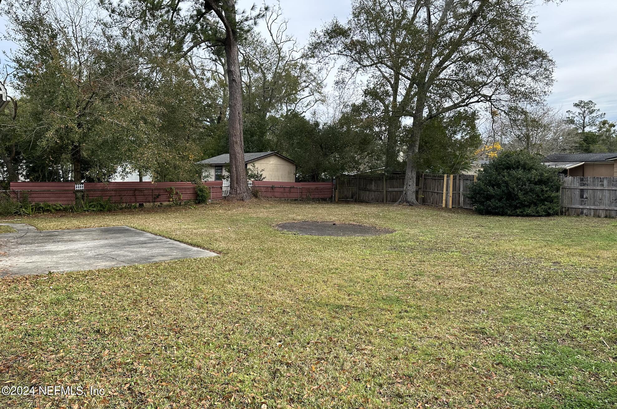 7417 Coral Sea Road Jacksonville, FL 32244 - Photo 2 of 10 a view of a patio with a table and chairs